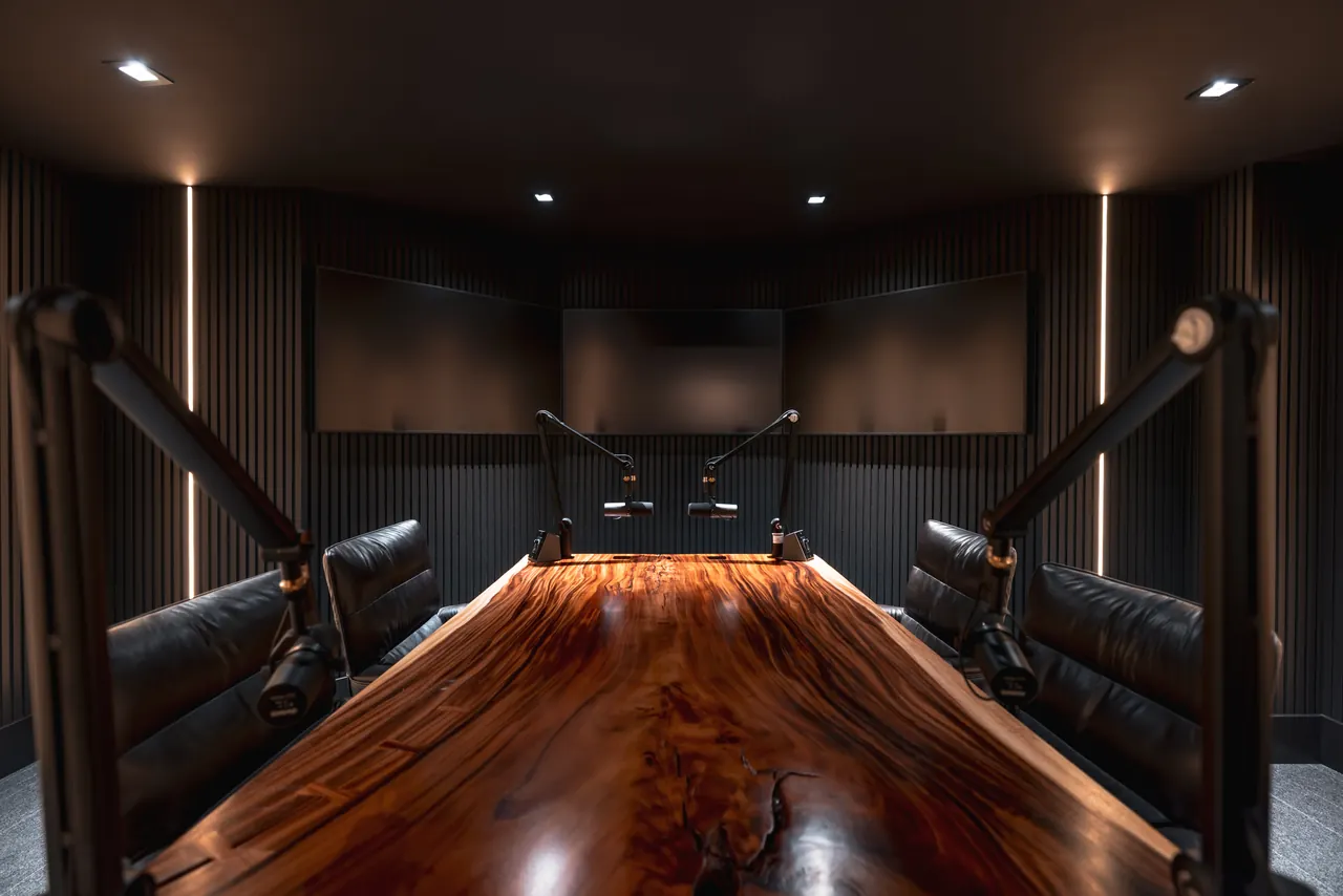 Acoustically treated studio interior with concealed speakers and linear lighting